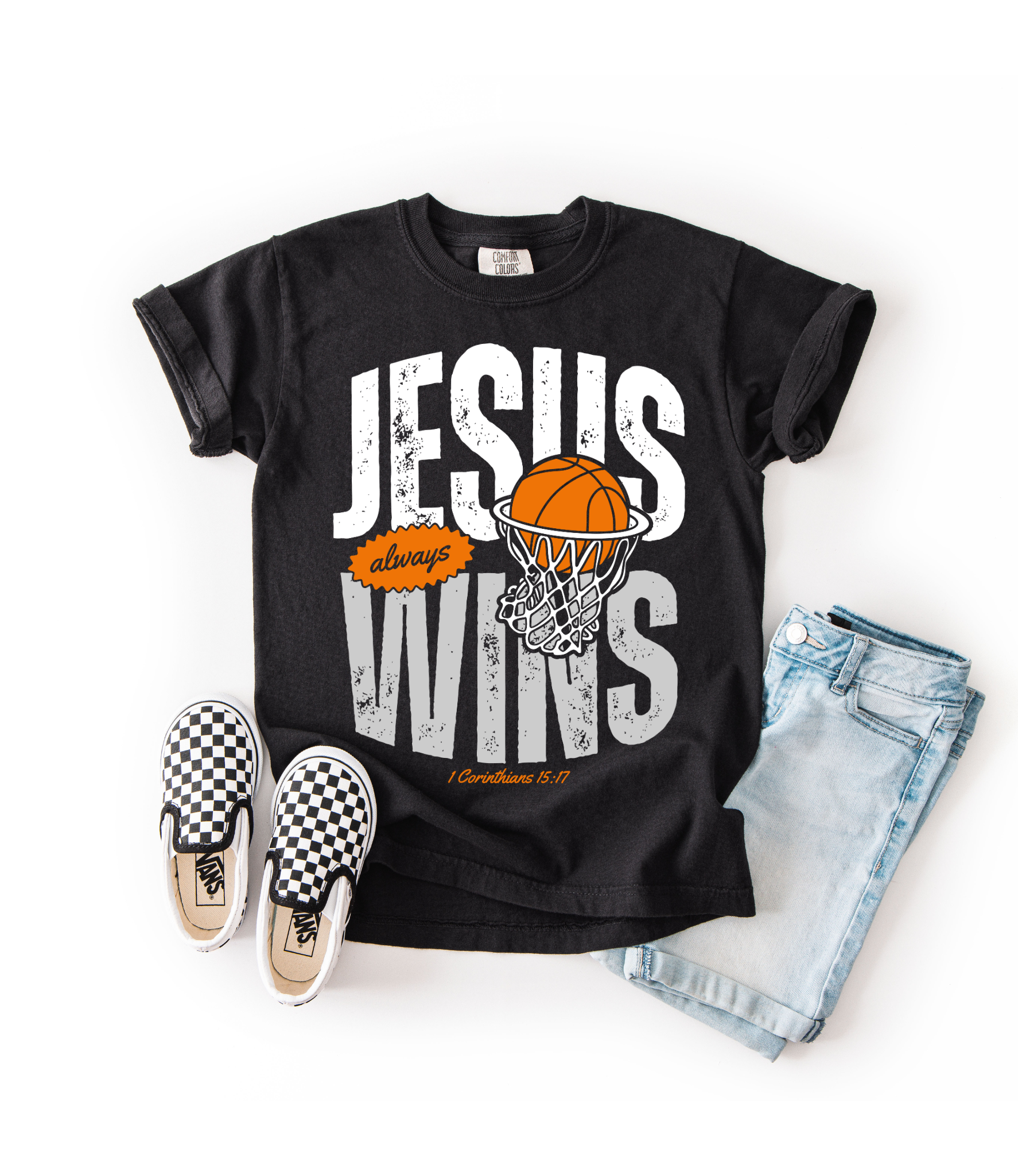 Black t-shirt with 'Jesus always wins' graphic, checkered shoes, and denim shorts on a white background