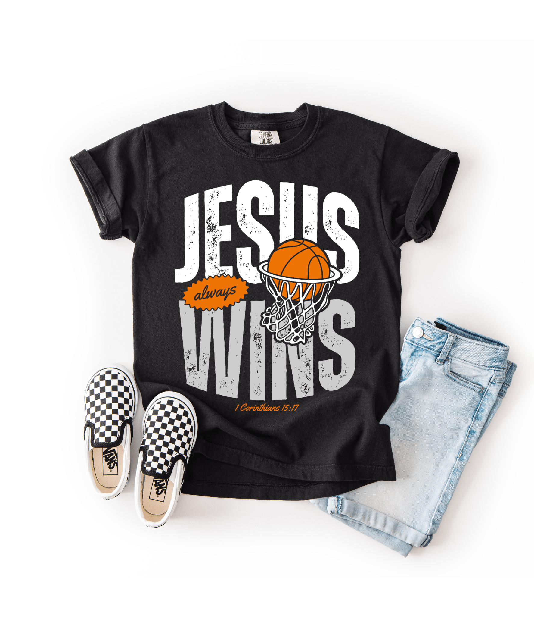 Black t-shirt with 'Jesus always wins' graphic, checkered shoes, and denim shorts on a white background