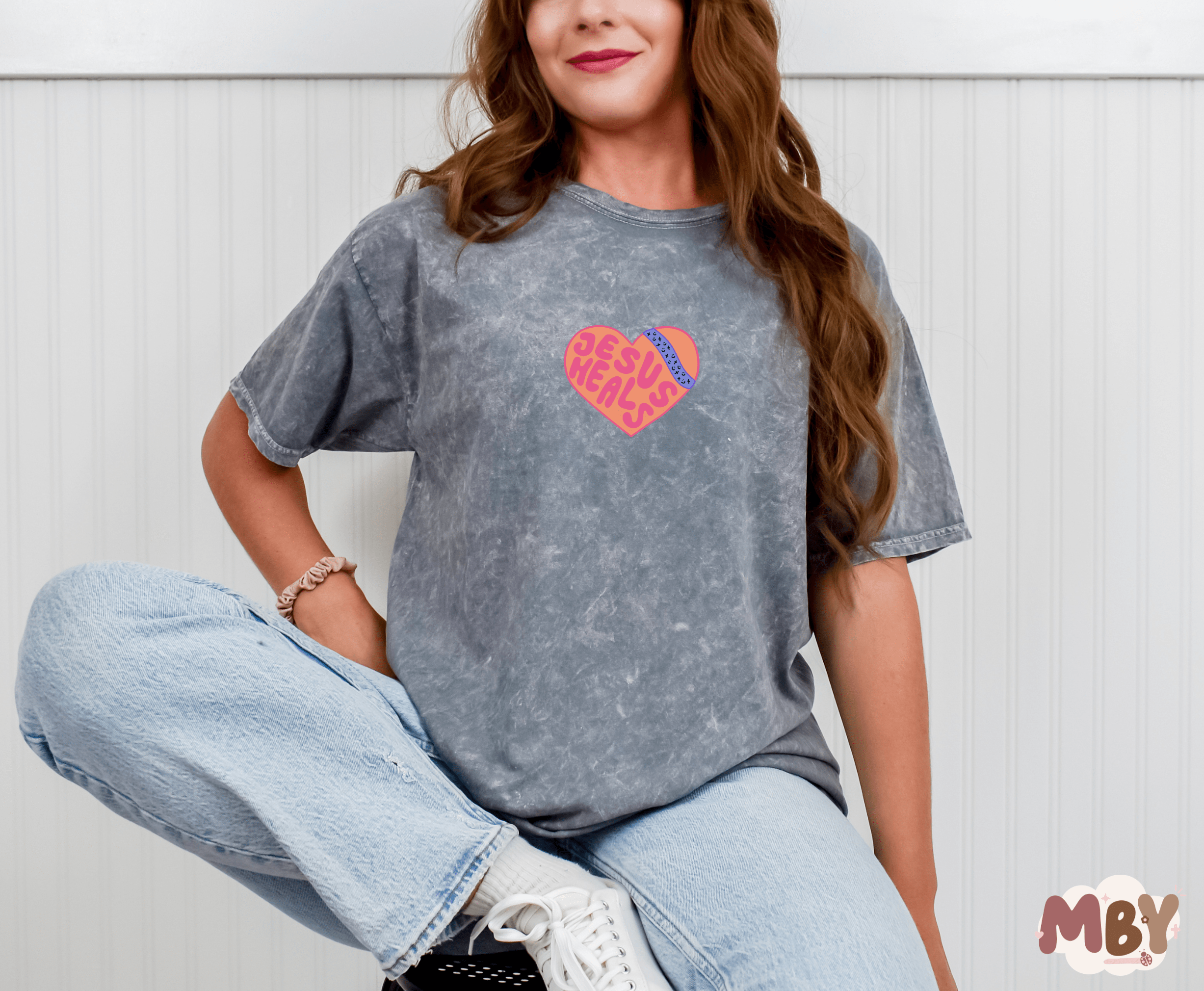 Jesus Heals - MADE BY YENJesus Heals T-Shirt featuring a bold faith-inspired design, perfect for sharing the message of Christ's healing power. Comfortable unisex Christian apparel made from a soft cotton-poly blend, ideal for casual wear, church events, or worship nights. Handmade by Made by Yen to inspire hope and faith in God's grace