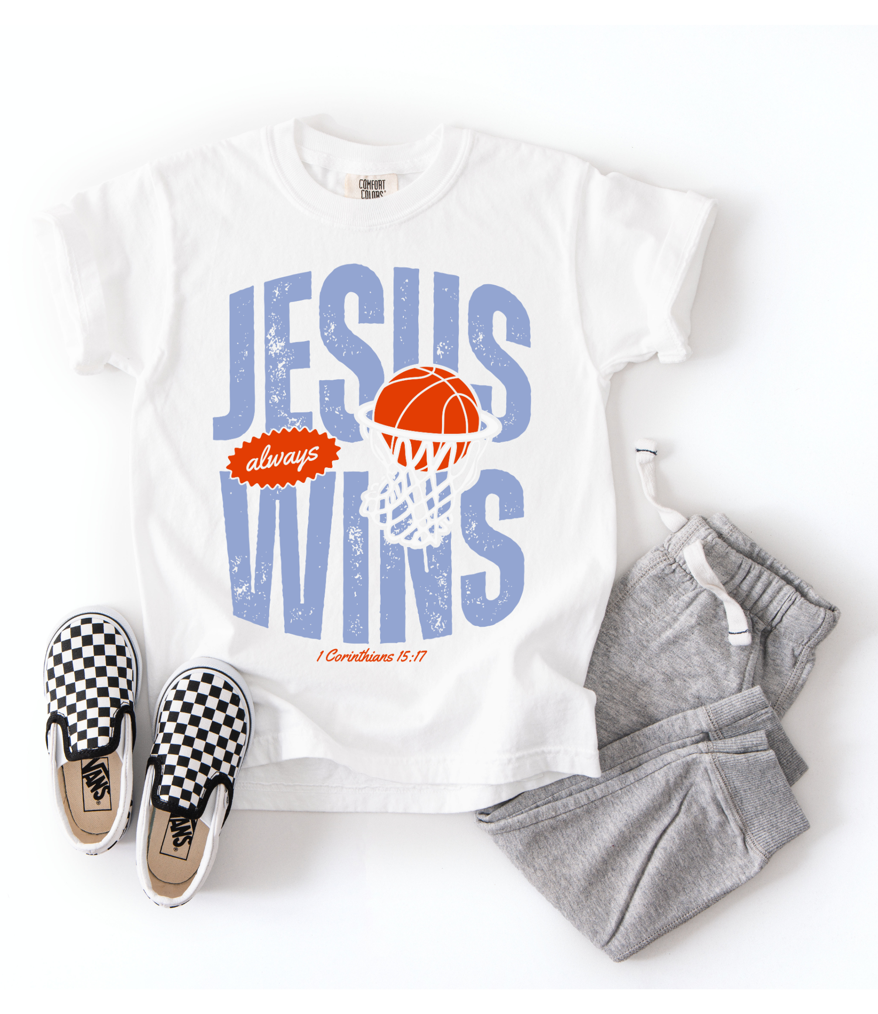White t-shirt with 'Jesus always wins' design, checkered shoes, and gray pants on a white background