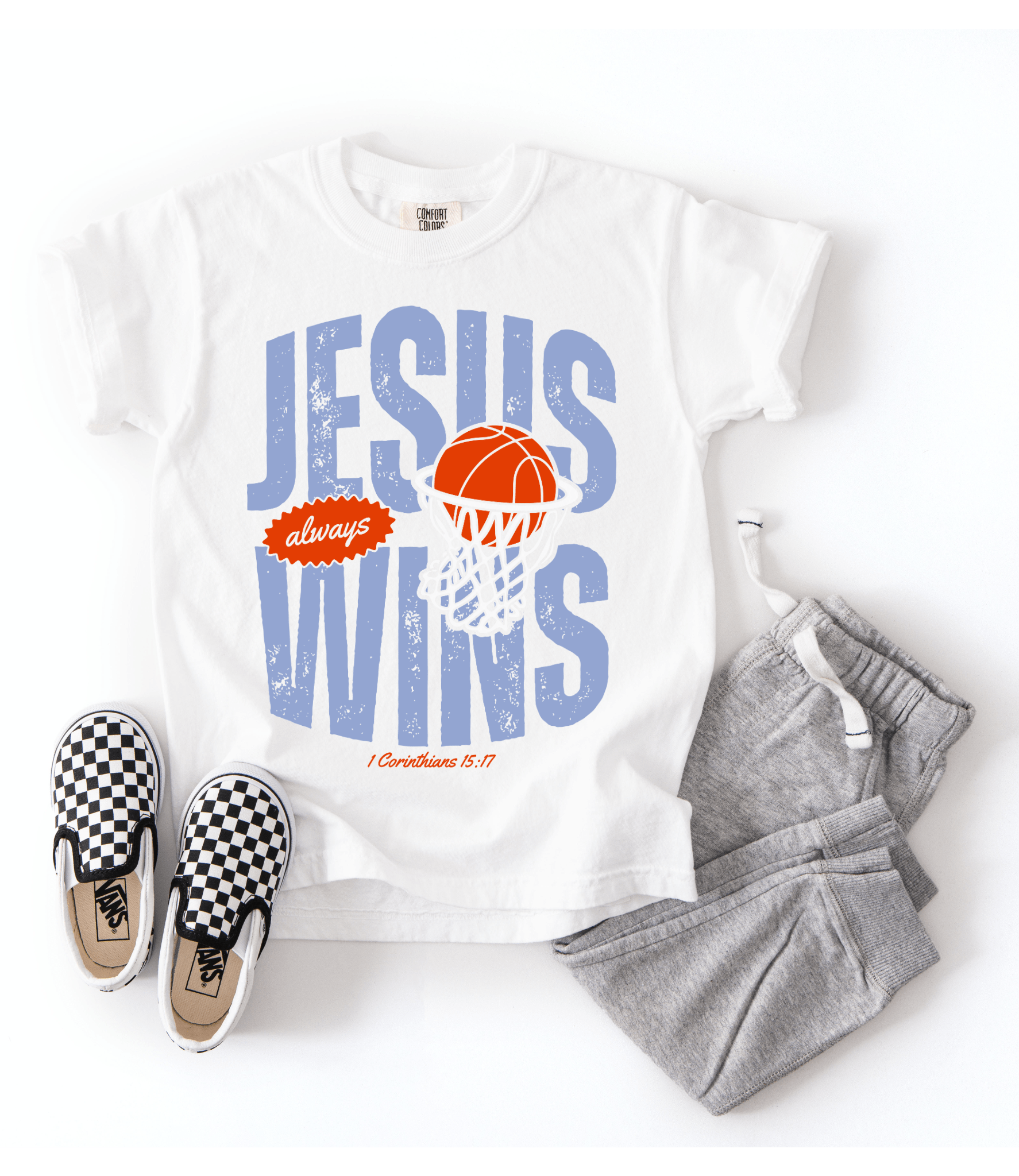 White t-shirt with 'Jesus always wins' design, checkered shoes, and gray pants on a white background