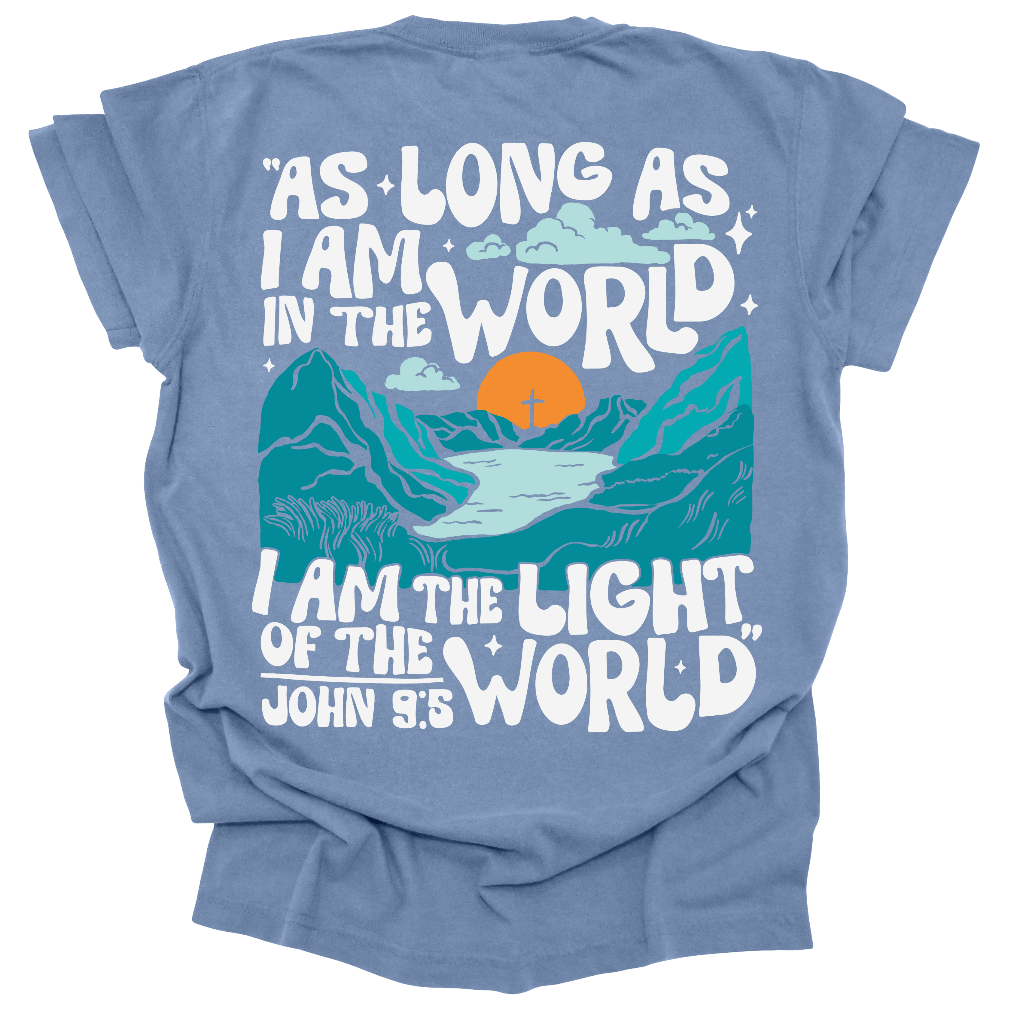 Washed Denim t-shirt featuring a bold mountain and sunrise design with the words "As long as I am in the world, I am the light of the world" from John 9:5.