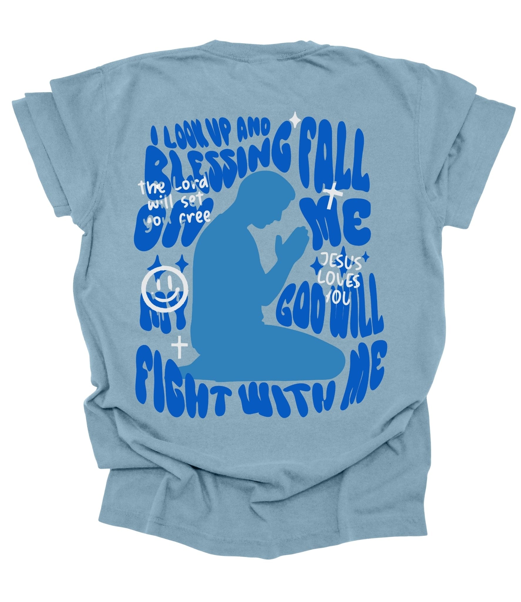 Faith-based Christian graphic tee with “No Stress” front text and bold prayer silhouette back design featuring encouraging scripture-inspired phrases on black, ivory, and ice blue shirts.