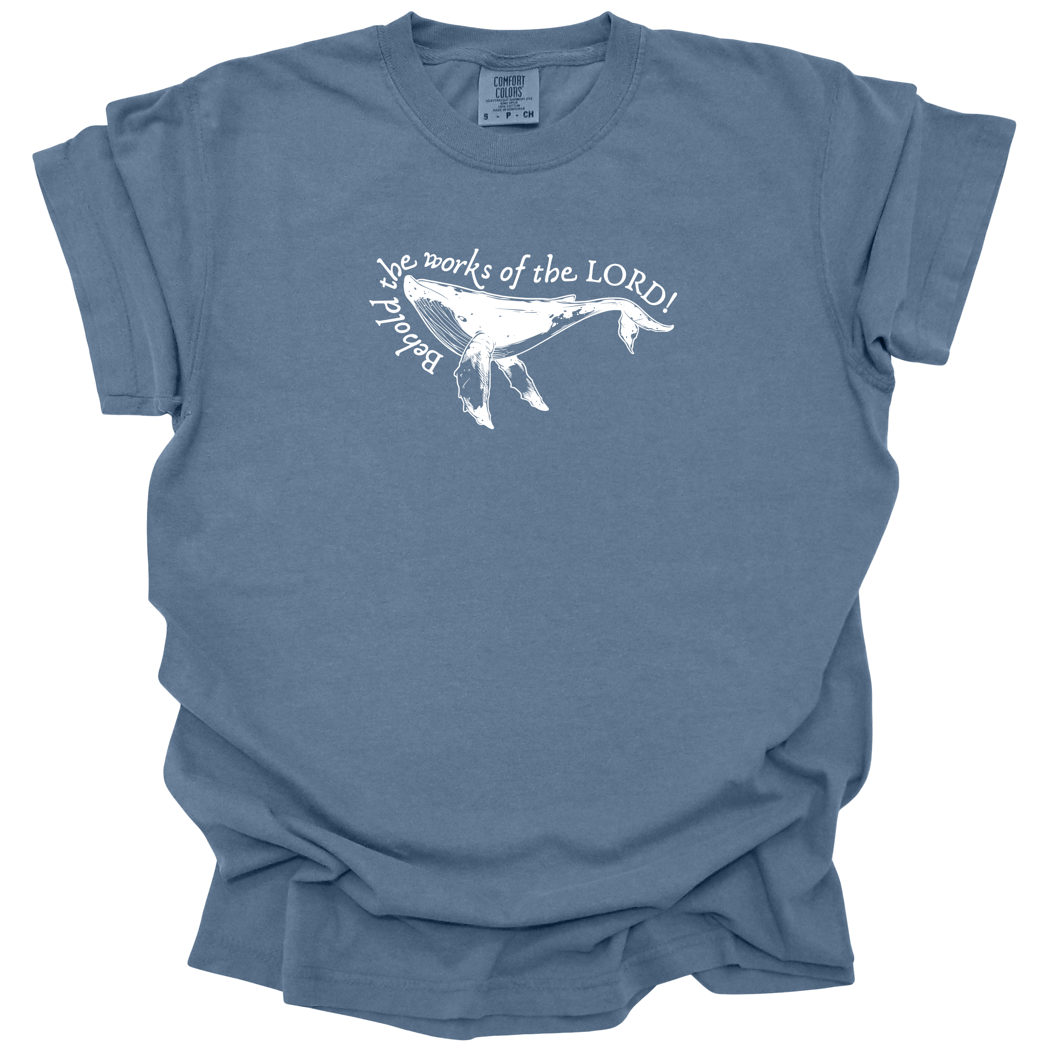 Humpback whale graphic with the text "Behold the works of the LORD!" on a washed denim Comfort Colors t-shirt.