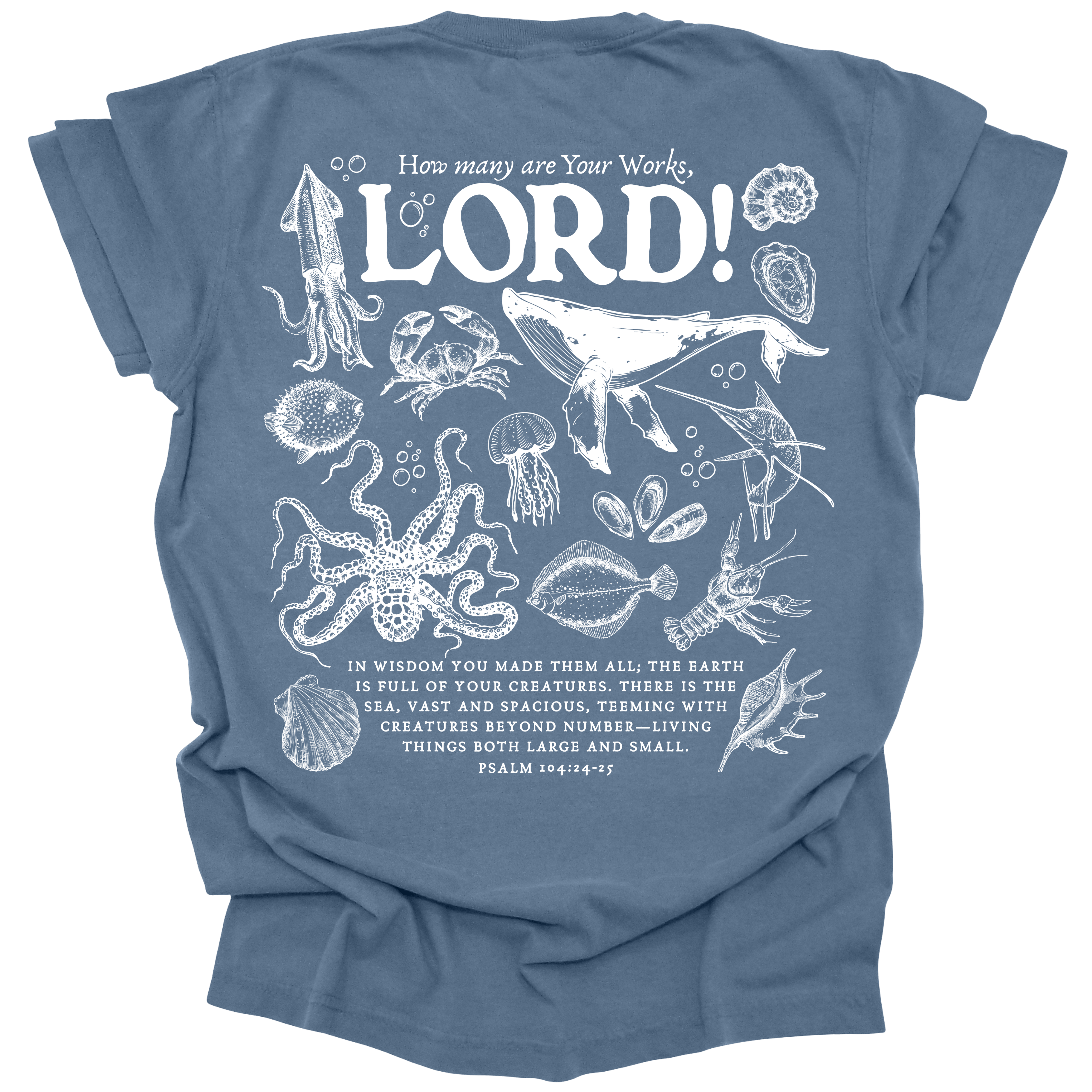 Detailed marine life illustration featuring a humpback whale, jellyfish, octopus, and other sea creatures with the text "How many are Your works, LORD!" and Psalm 104:24-25 on a washed denim Comfort Colors t-shirt.