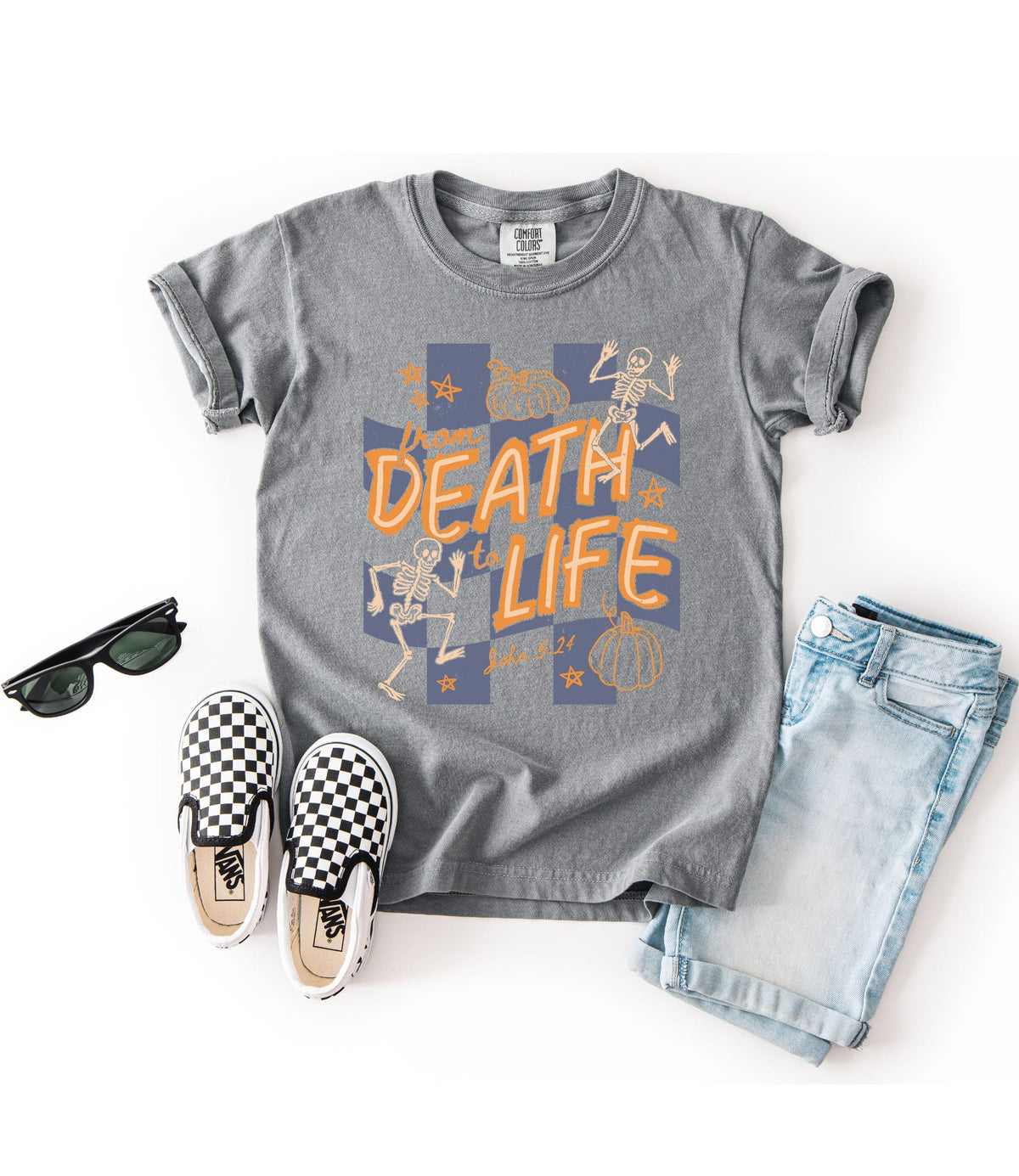 Gray kids Christian fall tee featuring From Death to Life from John 5:24 with orange and blue skeleton and pumpkin illustrations.