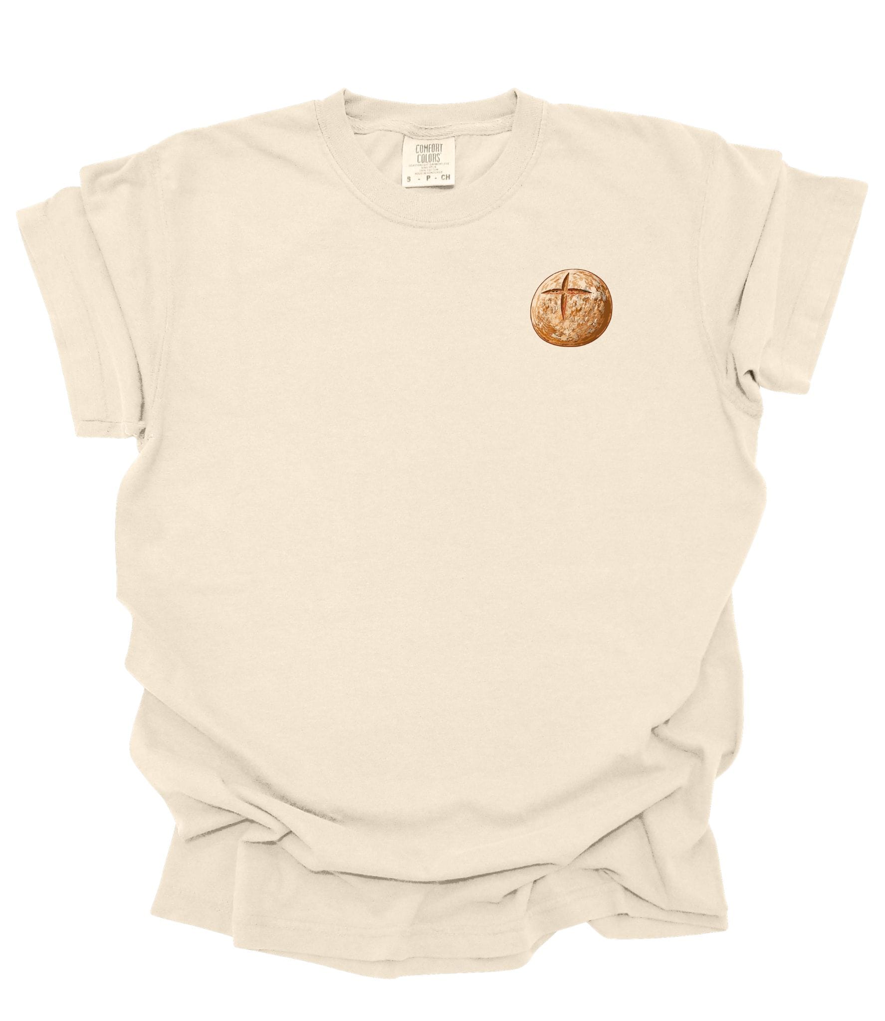 Front of ivory Comfort Colors Christian t-shirt featuring a small sourdough loaf graphic with a cross-scored crust printed on the left chest.
