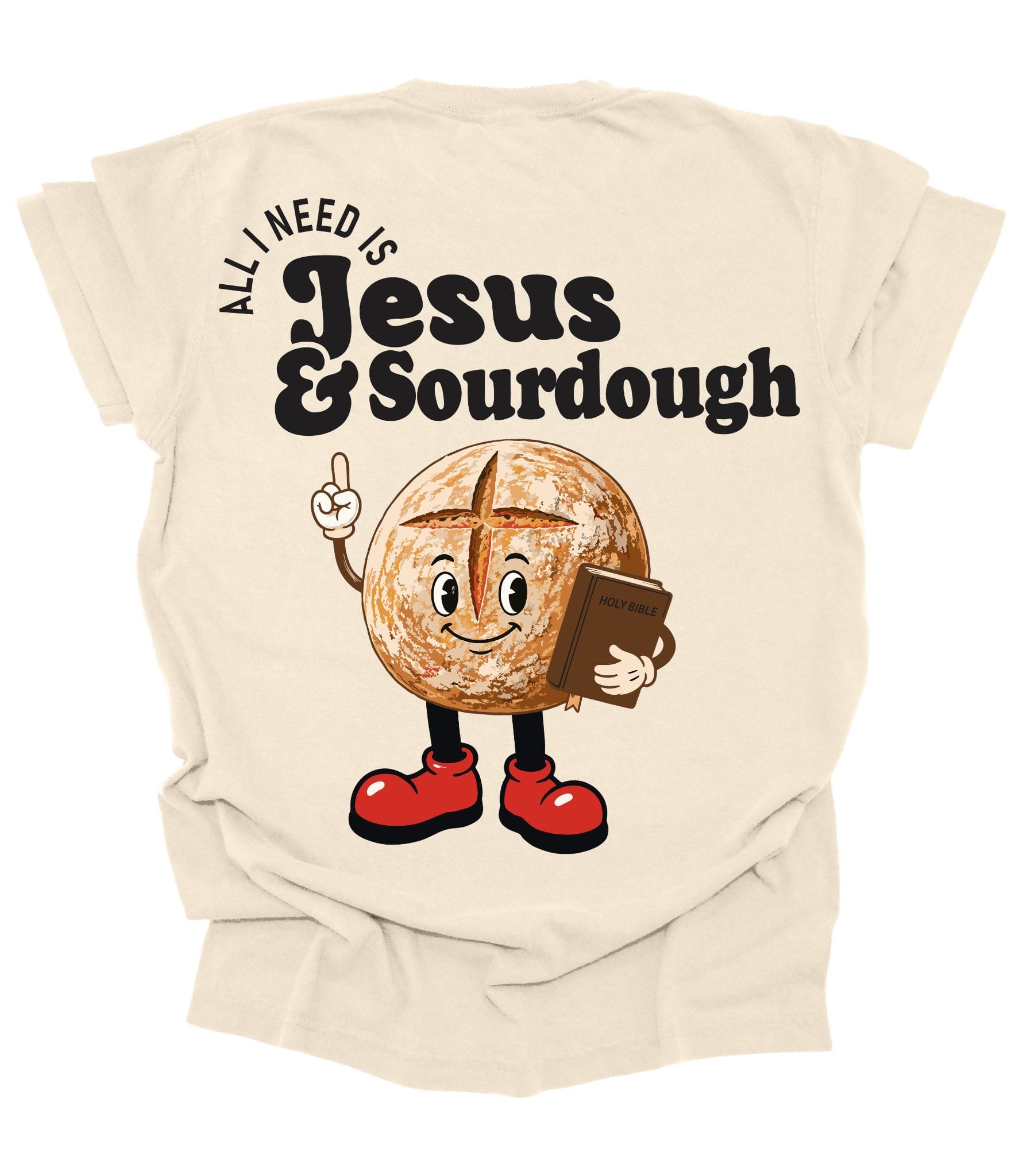 Back of ivory Comfort Colors Christian t-shirt featuring a retro sourdough bread character holding a Bible with the phrase "All I Need Is Jesus & Sourdough."
