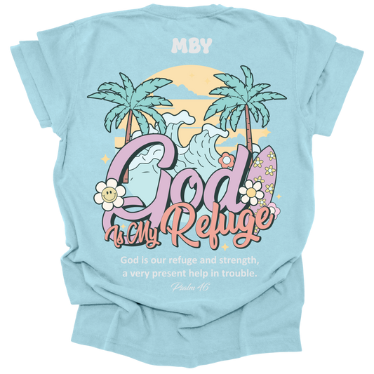 t-shirt featuring a large tropical scene with palm trees, waves, and surfboards, along with the words "God Is My Refuge" and the verse Psalm 46.