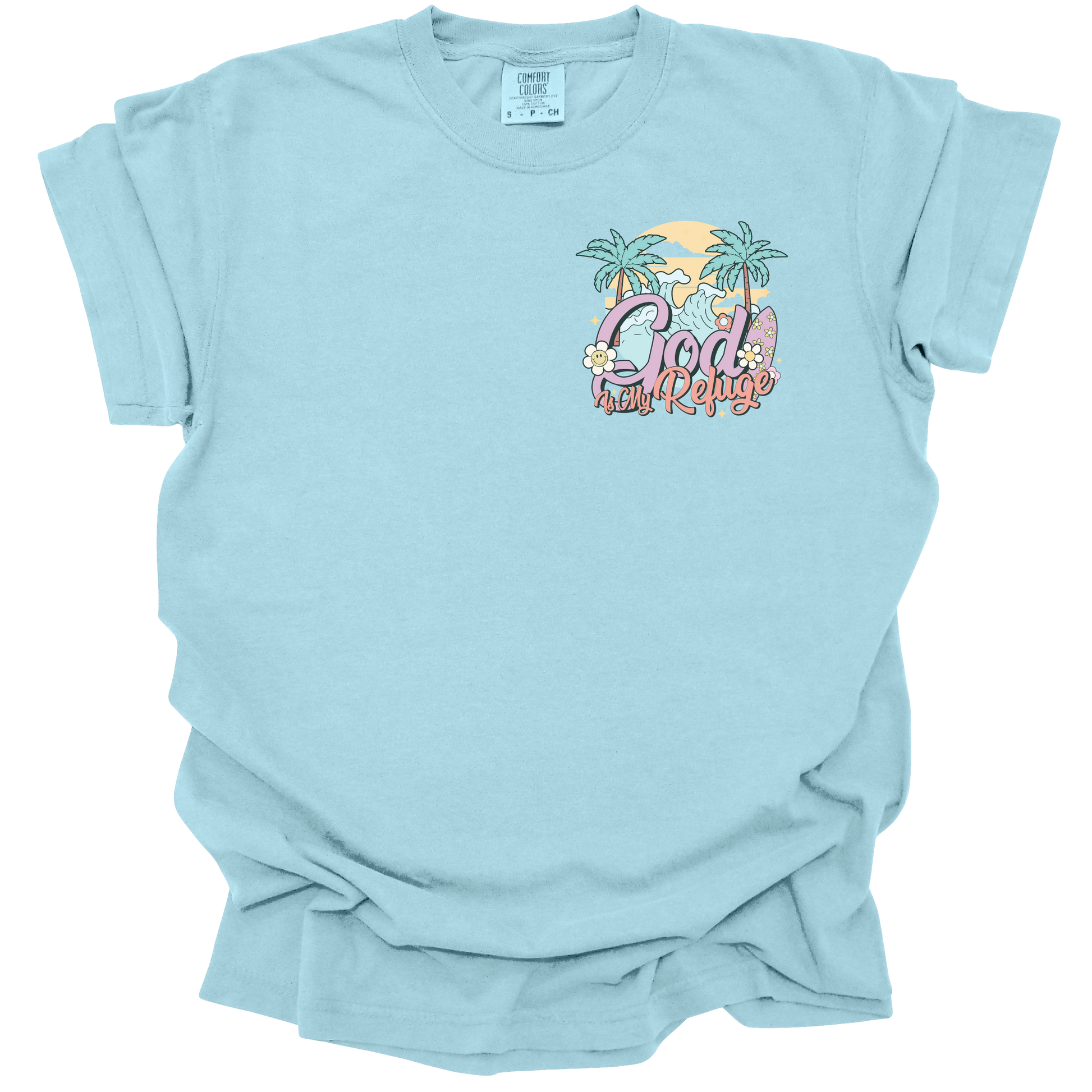 t-shirt with a small beach-themed design featuring the text "God Is My Refuge" with palm trees, waves, and pastel accents.