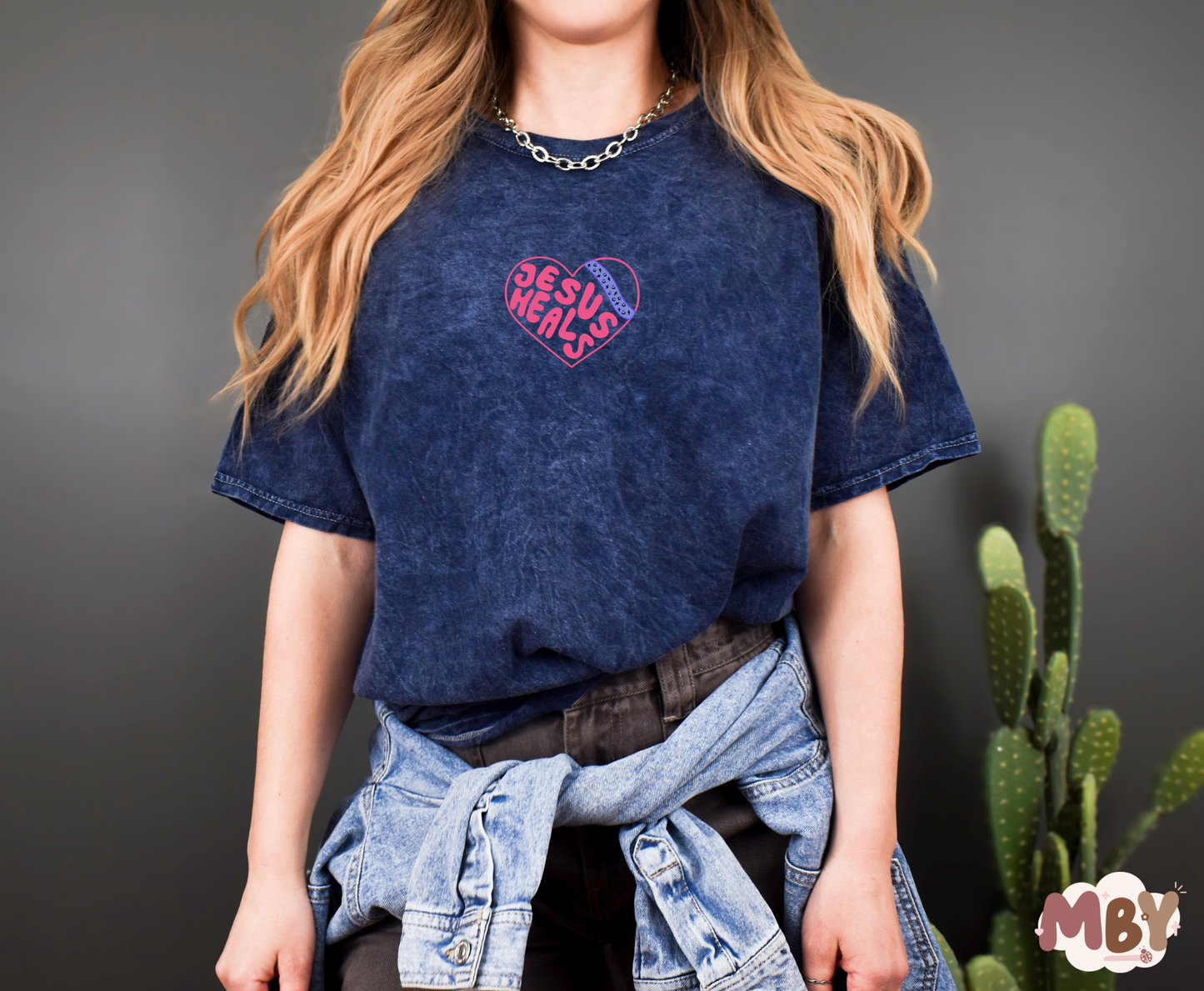 Jesus Heals - MADE BY YENJesus Heals T-Shirt featuring a bold faith-inspired design, perfect for sharing the message of Christ's healing power. Comfortable unisex Christian apparel made from a soft cotton-poly blend, ideal for casual wear, church events, or worship nights. Handmade by Made by Yen to inspire hope and faith in God's grace