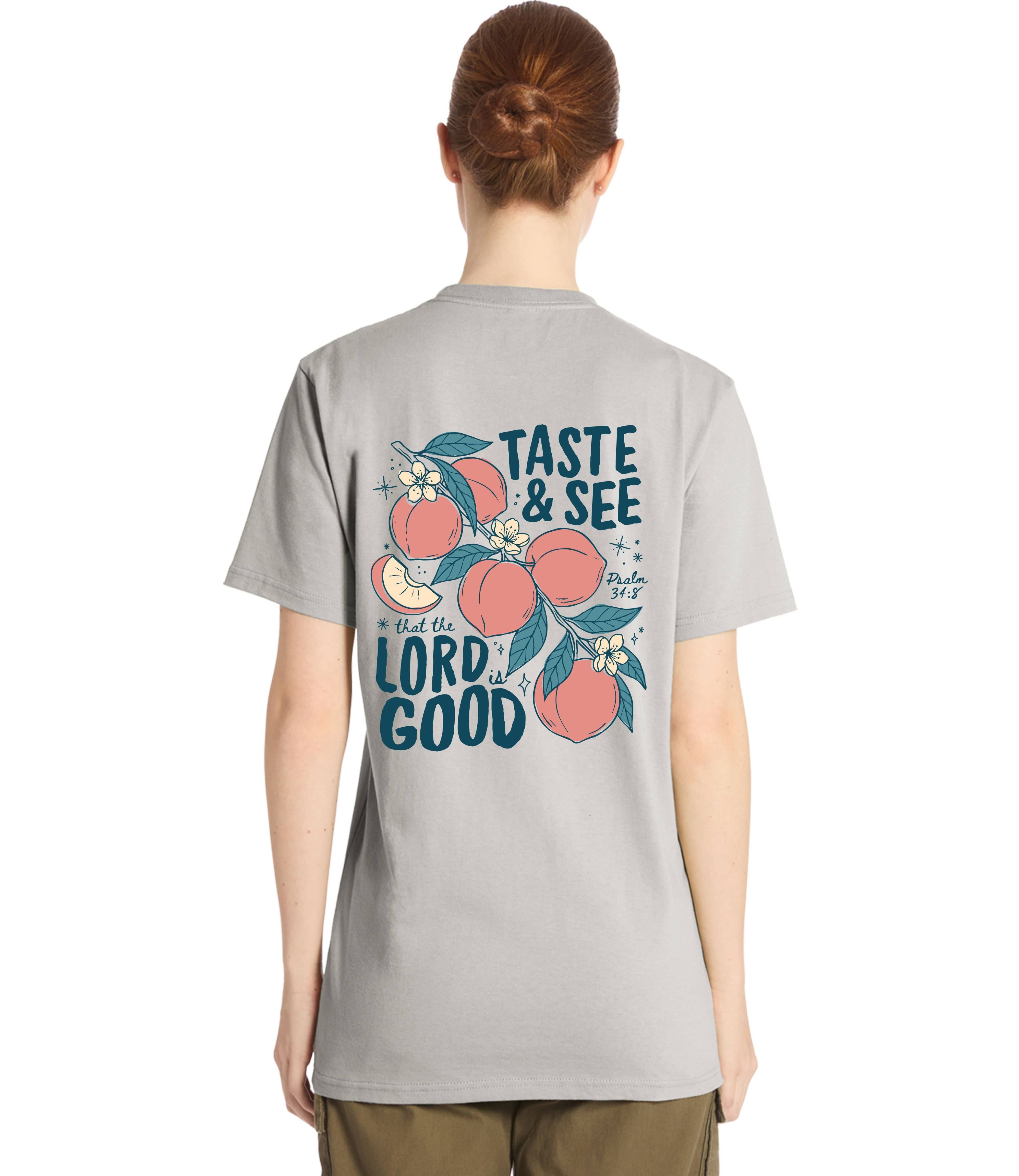 Back view of MADE BY YEN unisex tee featuring "The Lord is Good" and Psalm 34:8 in stylish typography.