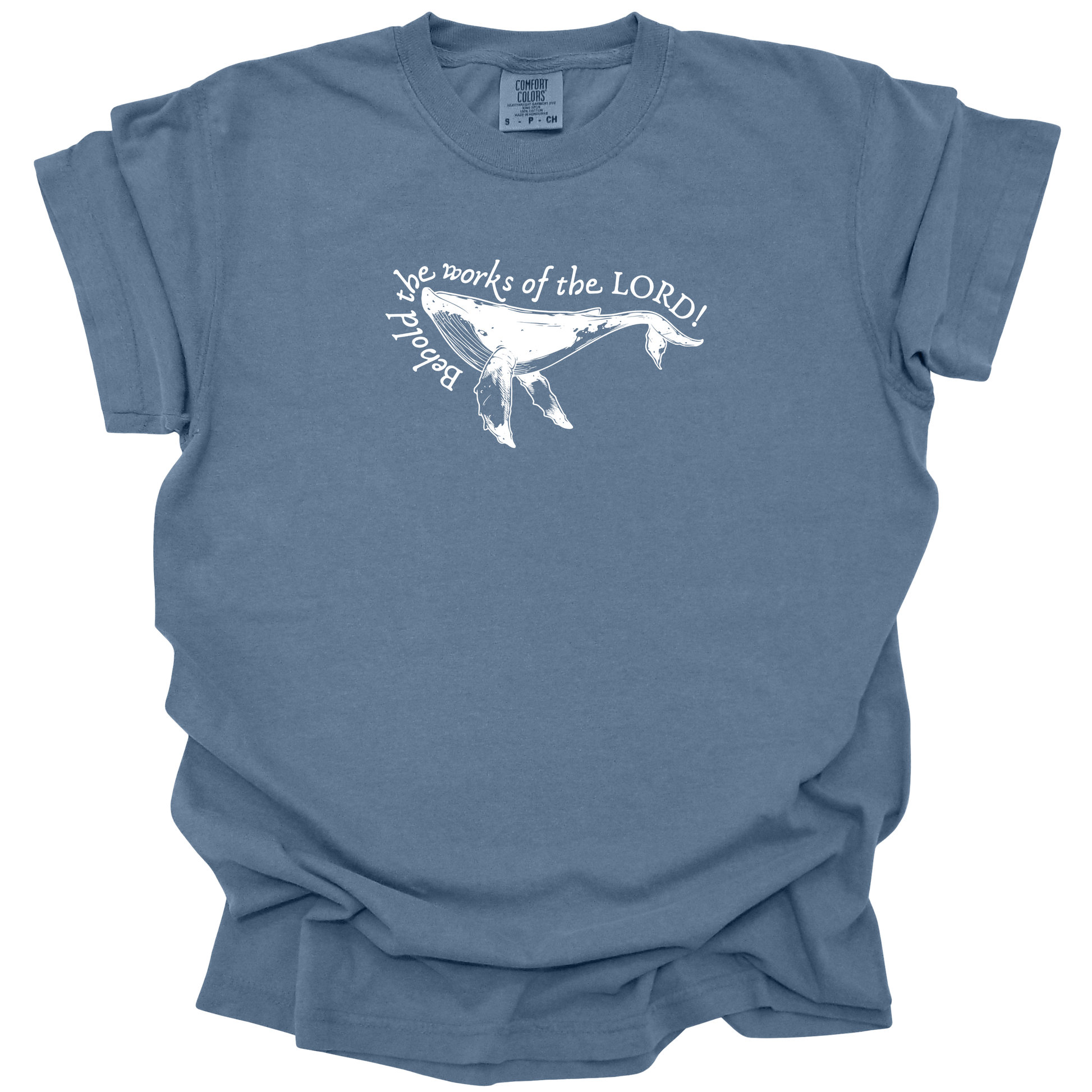 Humpback whale graphic with the text "Behold the works of the LORD!" on a washed denim Comfort Colors t-shirt.