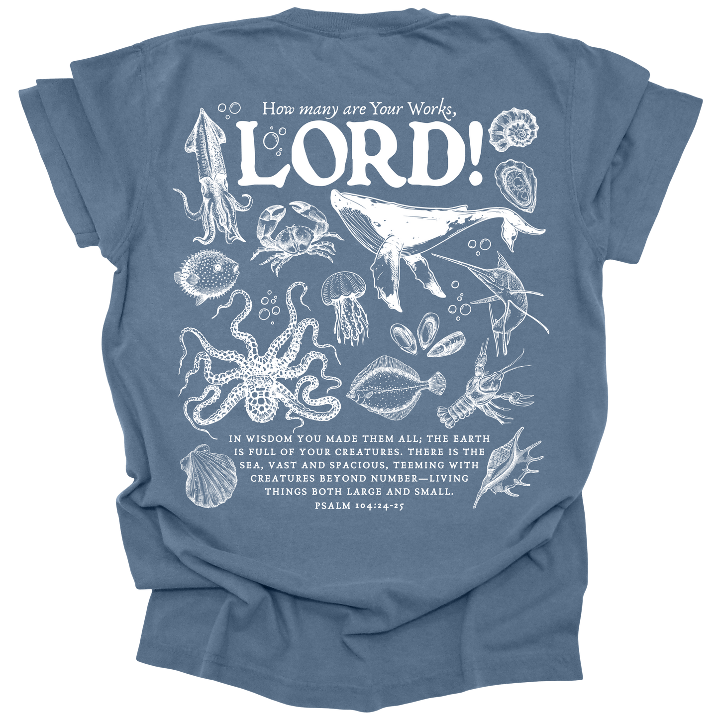 Detailed marine life illustration featuring a humpback whale, jellyfish, octopus, and other sea creatures with the text "How many are Your works, LORD!" and Psalm 104:24-25 on a washed denim Comfort Colors t-shirt.