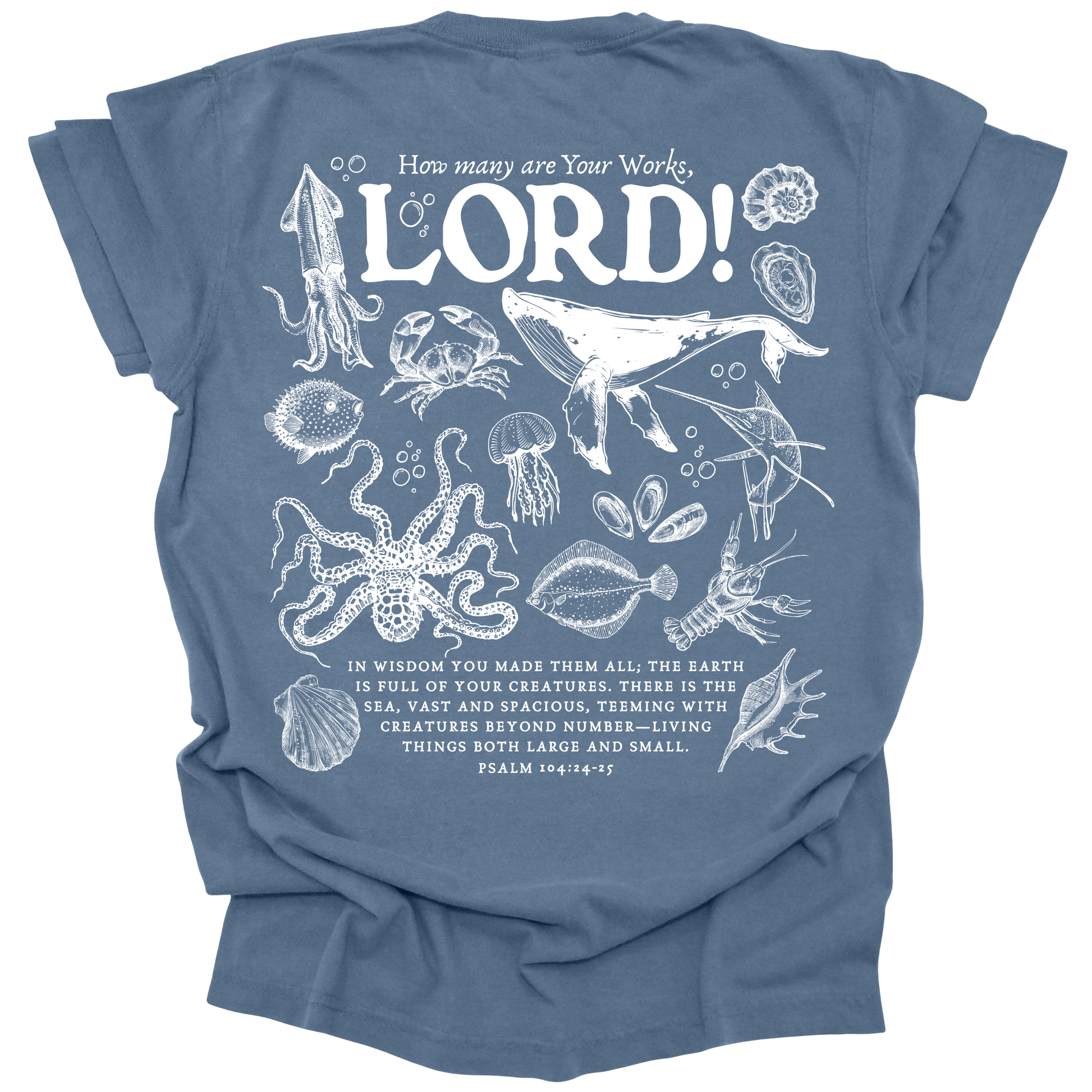 Detailed marine life illustration featuring a humpback whale, jellyfish, octopus, and other sea creatures with the text "How many are Your works, LORD!" and Psalm 104:24-25 on a washed denim Comfort Colors t-shirt.