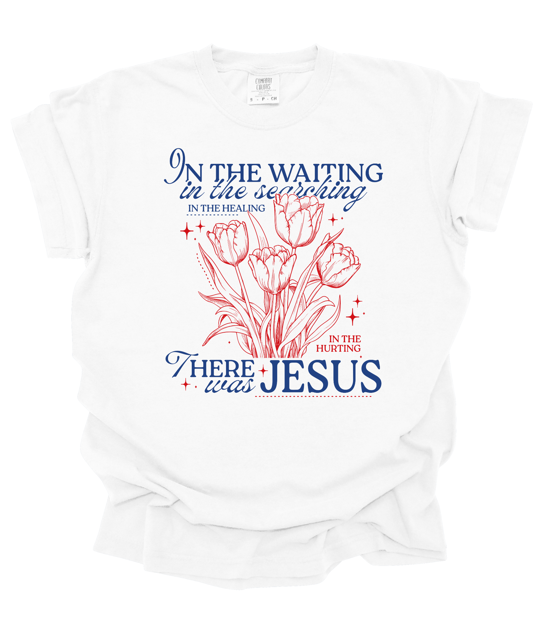 White t-shirt featuring red tulip drawing and blue/red text that reads: “In the waiting… there was Jesus.” Inspirational Christian floral shirt.

Let me know if you want a version for a caption or email campaign!