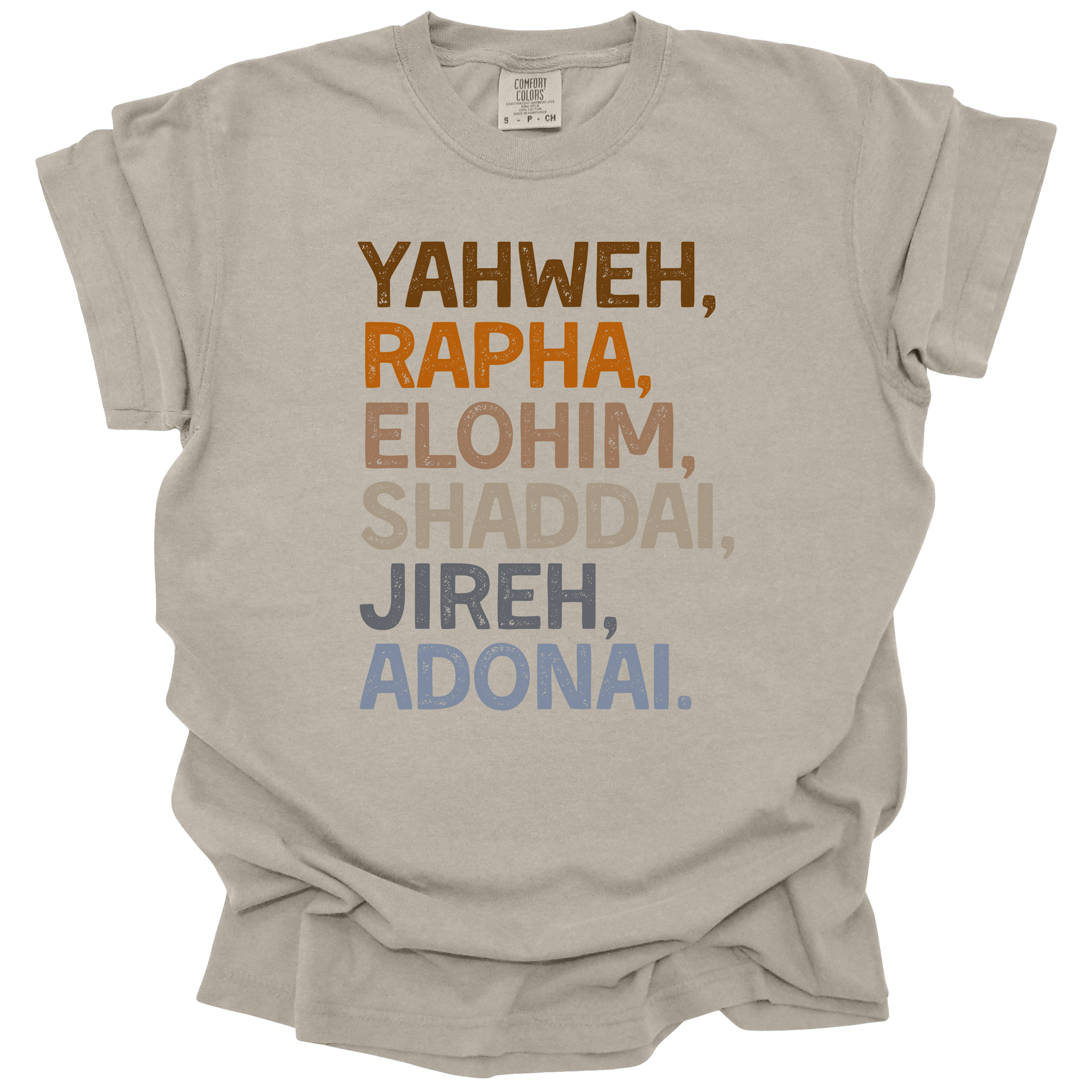 Names of God Tee in Sandstone featuring Yahweh, Rapha, Elohim, Shaddai, Jireh, and Adonai in bold typography. Oversized, unisex fit on a soft, pre-shrunk cotton tee.